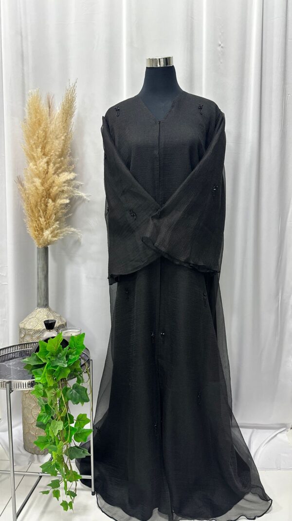 Straight buttoned up abaya with detailed handwork on sleeves and down the sides