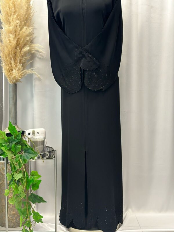 Straight buttoned up abaya embroidery with stoneson the sleeve and bottom