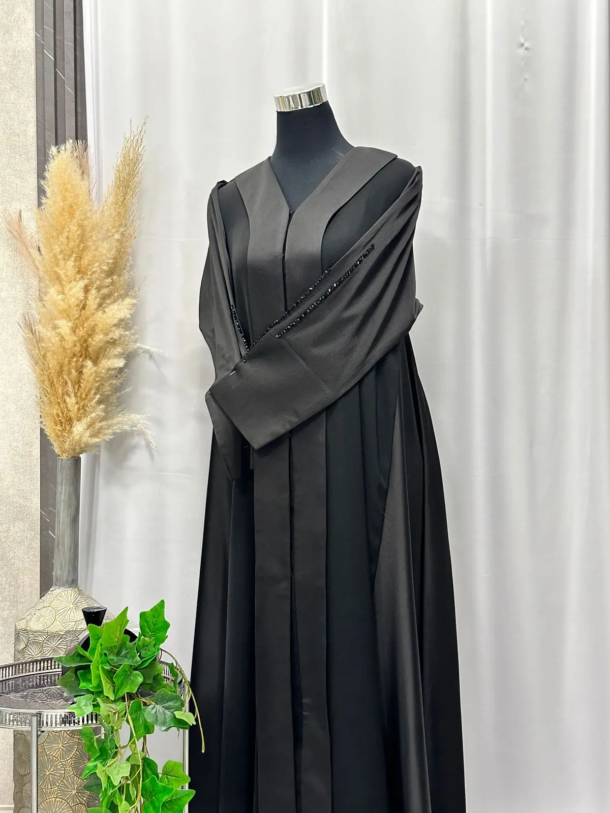 Umbrella styled buttoned up abaya with handworked stones on the sleeve
