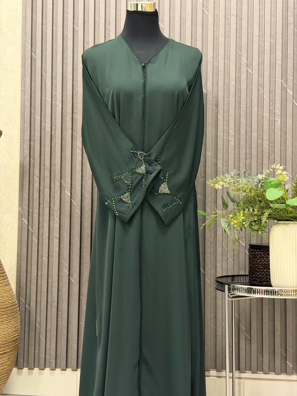 Buttoned up straight abaya with beaded work in the sleeves