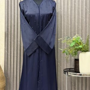 Buttoned up, tubes beaded work on the upper body