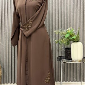 Buttoned up, beaded work on the shoulder and sleeves