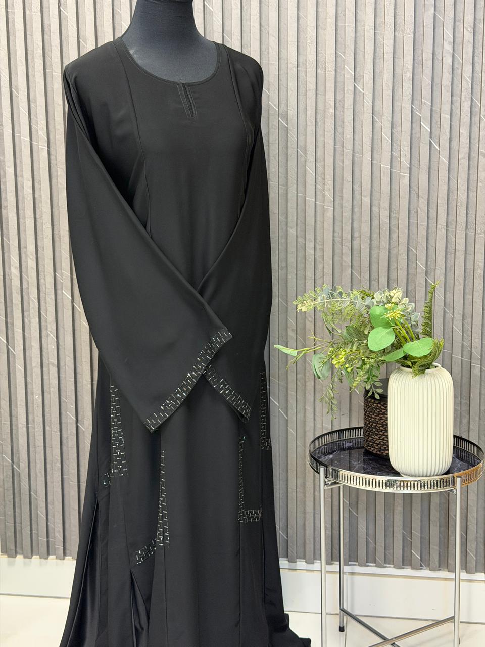 A- lined Abaya with premuim stonework and plaits on the side and back