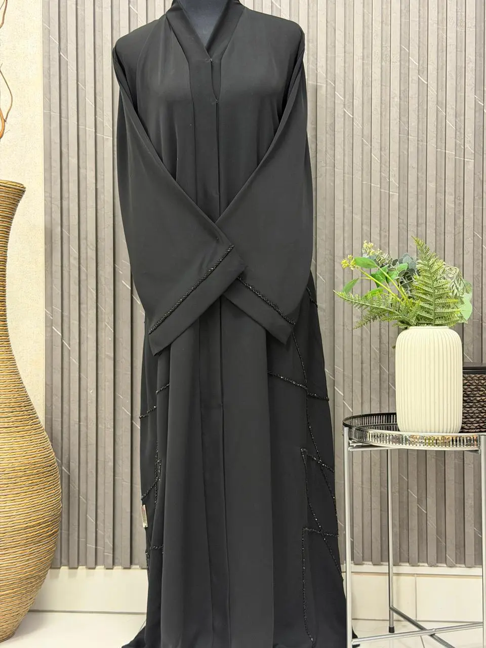 A- lined Abaya with beaded work on the sleeves and slide