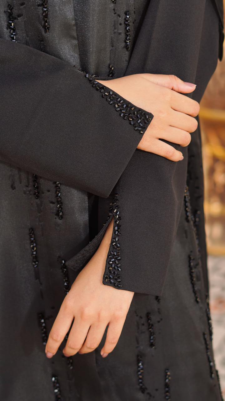 Self organza abaya with elegant stone work on the front, finished with subtle detailing on sleeves. Comes with a dupatta