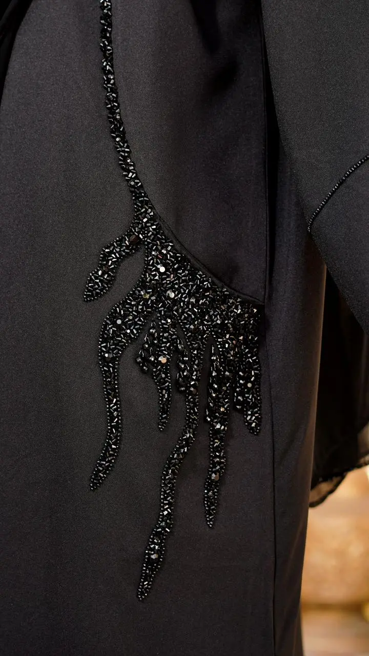Buttoned-up straight abaya featuring embedded beads on the sleeves and pockets - Image 2