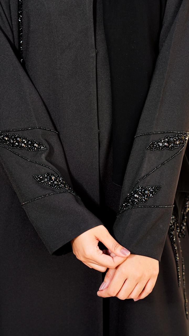 Buttoned-up straight abaya featuring embedded beads on the sleeves and pockets